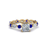 Load image into Gallery viewer, marquise-and-round-eternity-princess-cut-diamond-engagement-ring-with-sapphire-in-yellow-gold-FDEWB9398PRRGSABL-NL-YG_19bca82e-86a3-41ed-9315-9befe65f5729.jpg?v=1756456693
