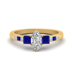 Load image into Gallery viewer, marquise-cut-channel-three-stone-diamond-engagement-ring-with-sapphire-in-yellow-gold-FDENS205MQRGSABL-NL-YG.jpg
