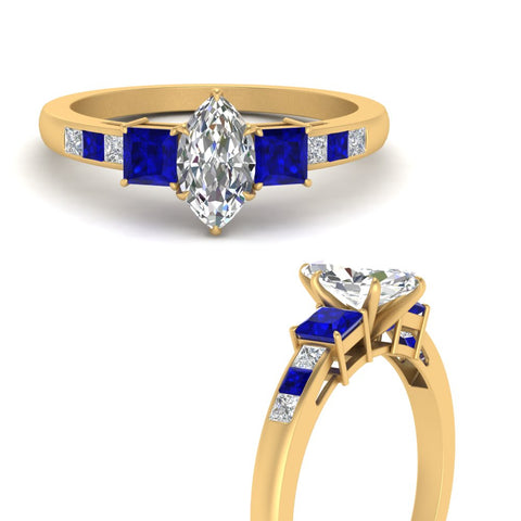 marquise-cut-channel-three-stone-diamond-engagement-ring-with-sapphire-in-yellow-gold-FDENS205MQRGSABL-NL-YG.jpg
