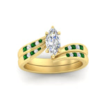 Load image into Gallery viewer, marquise-cut-swirl-channel-diamond-bridal-set-with-emerald-in-yellow-gold-FDENS4028MQGEMGR-NL-YG.jpg
