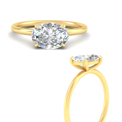 minimalist-east-west-oval-solitaire-diamond-ring-in-yellow-gold-fd11749ovrangle3-nl-yg.jpg?v=1777447605