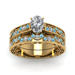 Load image into Gallery viewer, oval-cut-antique-filigree-wedding-ring-set-with-ice-blue-topaz-in-yellow-gold-FDENS3543OVGICBLTOANGLE5-NL-YG
