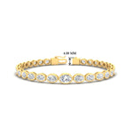 Load image into Gallery viewer, oval-diamond-bezel-set-bracelet-for-women-in-yellow-gold-fdbrc11733sleep-nl-yg-hw.jpg?v=1776314685