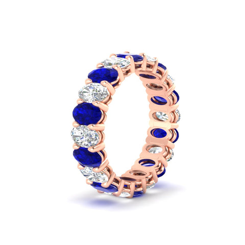 oval-diamond-eternity-wedding-band-7-carat-with-blue-sapphire-in-rose-gold-fdewb8324ovgsablangle2-5.50x3.50mm-nl-rg
