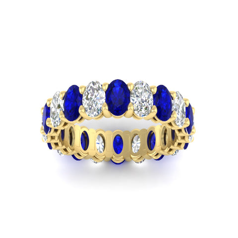 oval-diamond-eternity-wedding-band-7-carat-with-blue-sapphire-in-yellow-gold-fdewb8324ovgsablangle5-5.50x3.50mm-nl-yg