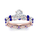 Load image into Gallery viewer, oval-sapphire-floating-marquise-accent-ring-with-eternity-wedding-band-in-rose-gold-FDEWB9398OVGSABLANGLE5-NL-RG.jpg?v=1758802222
