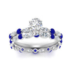 Load image into Gallery viewer, oval-sapphire-floating-marquise-accent-ring-with-eternity-wedding-band-in-white-gold-FDEWB9398OVGSABLANGLE5-NL-WG_f486d240-9c6b-42c2-a7ea-ab447edddc8f.jpg?v=1758802151