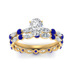 Load image into Gallery viewer, oval-sapphire-floating-marquise-accent-ring-with-eternity-wedding-band-in-yellow-gold-FDEWB9398OVGSABLANGLE5-NL-YG_f71ae32c-5504-4db9-bf5a-af27245cb8fe.jpg?v=1758802150