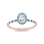 Load image into Gallery viewer, oval-shaped-blue-topaz-halo-petite-engagement-ring-in-rose-gold-FD8523OVRGICBLTOANGLE3-NL-RG