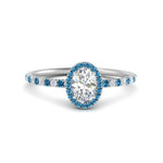 Load image into Gallery viewer, oval-shaped-blue-topaz-halo-petite-engagement-ring-in-white-gold-FD8523OVRGICBLTOANGLE3-NL-WG