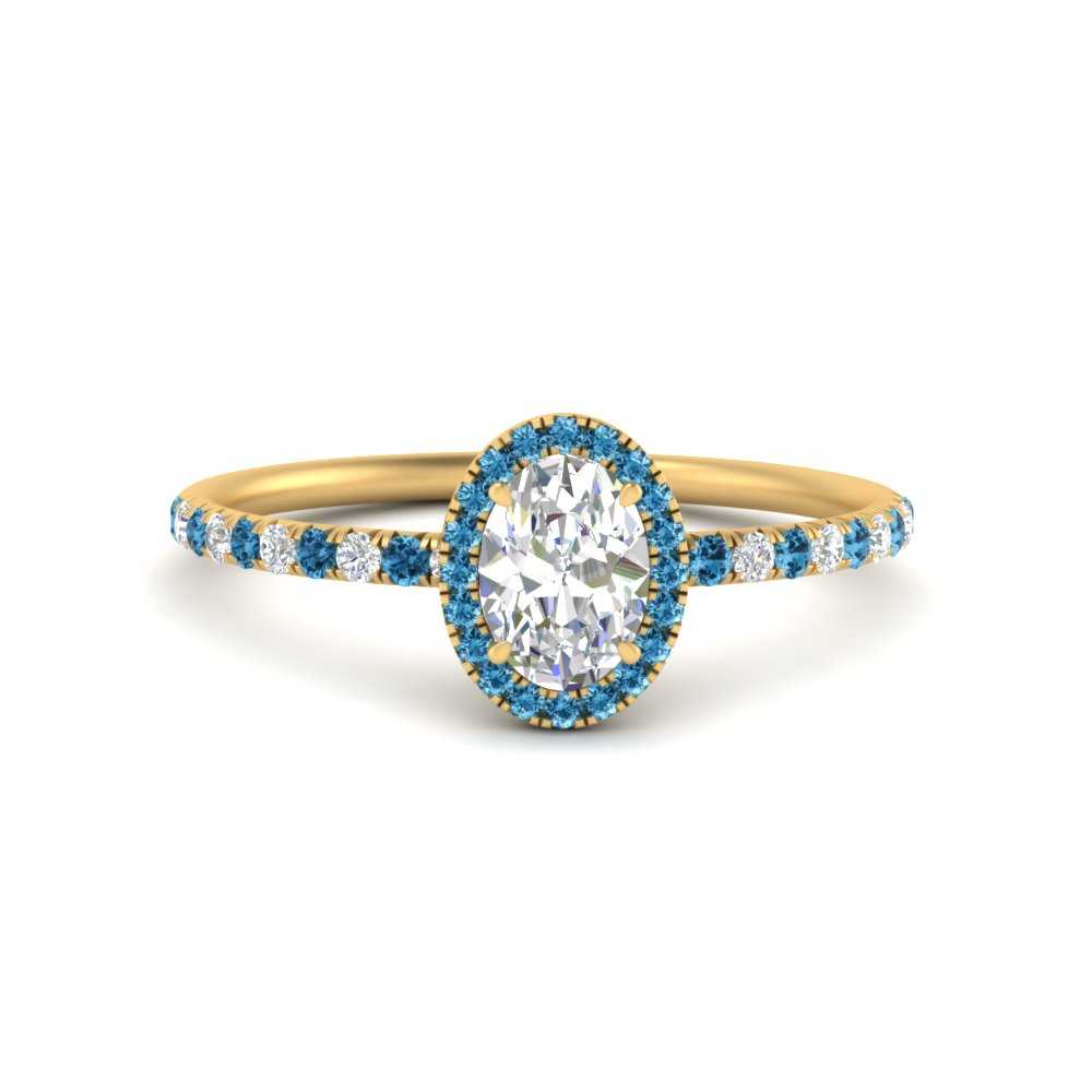 oval-shaped-blue-topaz-halo-petite-engagement-ring-in-yellow-gold-FD8523OVRGICBLTOANGLE3-NL-YG