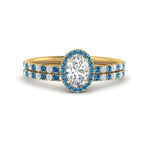 Load image into Gallery viewer, oval-shaped-blue-topaz-halo-wedding-ring-set-in-yellow-gold-FD8523OVGICBLTO-NL-YG
