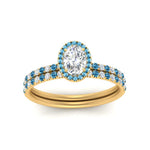 Load image into Gallery viewer, oval-shaped-blue-topaz-halo-wedding-ring-set-in-yellow-gold-FD8523OVGICBLTO-NL-YG
