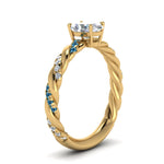 Load image into Gallery viewer, oval-shaped-blue-topaz-twisted-vine-engagement-ring-in-yellow-gold-FD9127OVRGICBLTOANGLE2-NL-YG
