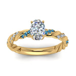 Load image into Gallery viewer, oval-shaped-blue-topaz-twisted-vine-engagement-ring-in-yellow-gold-FD9127OVRGICBLTOANGLE5-NL-YG
