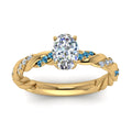Thumbnail 78 - oval-shaped-blue-topaz-twisted-vine-engagement-ring-in-yellow-gold-FD9127OVRGICBLTOANGLE5-NL-YG