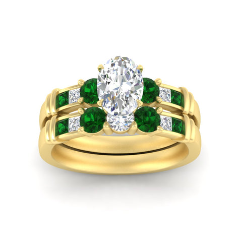 oval-shaped-bridal-ring-set-with-emerald-princess-channel-accents-in-yellow-gold-fdens286ovgemgrangle5-nl-yg.jpg