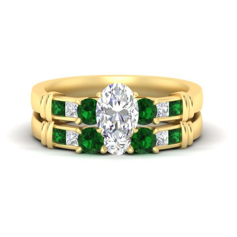 oval-shaped-bridal-ring-set-with-emerald-princess-channel-accents-in-yellow-gold-fdens286ovgemgrsleep-nl-yg.jpg
