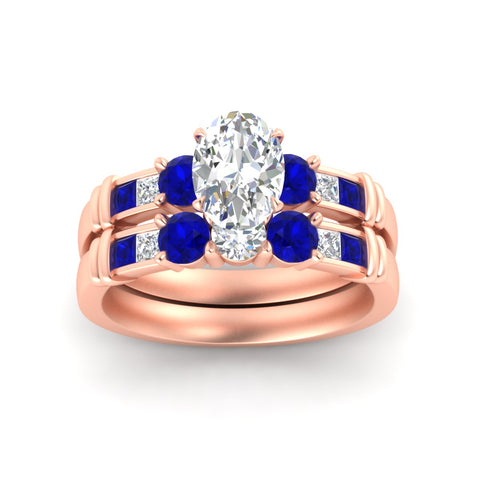oval-shaped-bridal-ring-set-with-sapphire-princess-channel-accents-in-rose-gold-fdens286ovgsablangle5-nl-rg.jpg