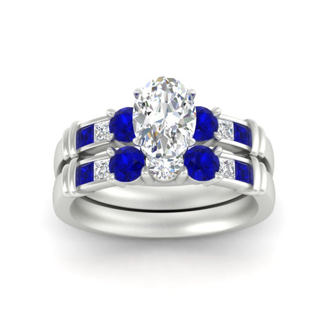 oval-shaped-bridal-ring-set-with-sapphire-princess-channel-accents-in-white-gold-fdens286ovgsablangle5-nl-wg.jpg
