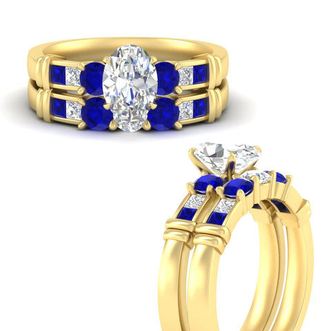oval-shaped-bridal-ring-set-with-sapphire-princess-channel-accents-in-yellow-gold-fdens286ovgsablangle3-nl-yg.jpg