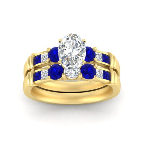 oval-shaped-bridal-ring-set-with-sapphire-princess-channel-accents-in-yellow-gold-fdens286ovgsablangle5-nl-yg.jpg