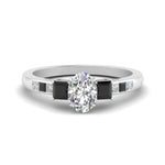 Load image into Gallery viewer, oval-shaped-channel-three-stone-diamond-engagement-ring-with-black-diamond-in-white-gold-FDENS205OVRGBLACK-NL-WG.jpg
