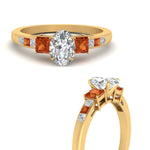 Load image into Gallery viewer, oval-shaped-channel-three-stone-diamond-engagement-ring-with-orange-sapphire-in-yellow-gold-FDENS205OVRGSAOR-NL-YG.jpg
