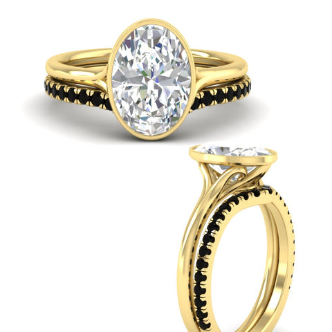 oval-shaped-diamond-bezel-solitaire-ring-with-black-diamond-band-in-yellow-gold-FD11229OVGBLACKANGLE3-NL-YG.jpg?v=1758702861