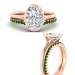 Load image into Gallery viewer, oval-shaped-diamond-bezel-solitaire-ring-with-emerald-band-in-rose-gold-FD11229OVGEMGRANGLE3-NL-RG_7b7ee7ea-e704-4cd8-a97e-36a4a6a368cb.jpg?v=1758702938
