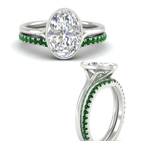 oval-shaped-diamond-bezel-solitaire-ring-with-emerald-band-in-white-gold-FD11229OVGEMGRANGLE3-NL-WG_fea6484e-b66c-4788-8daf-b7097b14126e.jpg?v=1758702938