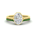 Load image into Gallery viewer, oval-shaped-diamond-bezel-solitaire-ring-with-emerald-band-in-yellow-gold-FD11229OVGEMGR-NL-YG_249dfcdf-a526-4213-9a42-0769778053e7.jpg?v=1758702938
