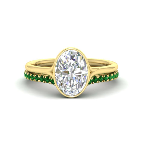 oval-shaped-diamond-bezel-solitaire-ring-with-emerald-band-in-yellow-gold-FD11229OVGEMGR-NL-YG.jpg?v=1758702860