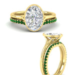 Load image into Gallery viewer, oval-shaped-diamond-bezel-solitaire-ring-with-emerald-band-in-yellow-gold-FD11229OVGEMGRANGLE3-NL-YG_774c37c2-a114-489c-9e25-eb62dc9d99b5.jpg?v=1758702938
