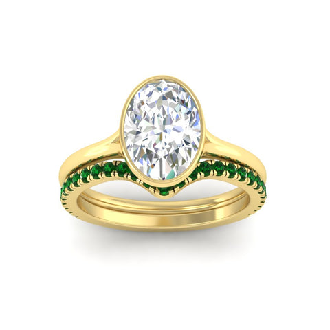 oval-shaped-diamond-bezel-solitaire-ring-with-emerald-band-in-yellow-gold-FD11229OVGEMGRANGLE5-NL-YG_9b58e42e-85fe-4336-a270-2c01da472275.jpg?v=1758702938