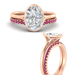 Load image into Gallery viewer, oval-shaped-diamond-bezel-solitaire-ring-with-pink-sapphire-band-in-rose-gold-FD11229OVGSADRPIANGLE3-NL-RG_8080337a-7f9f-4662-864e-1b89b64b785e.jpg?v=1758702937
