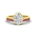 Load image into Gallery viewer, oval-shaped-diamond-bezel-solitaire-ring-with-pink-sapphire-band-in-yellow-gold-FD11229OVGSADRPI-NL-YG_8dbd8cc1-4bf3-4b95-9bc2-9007347ee2ab.jpg?v=1758702938
