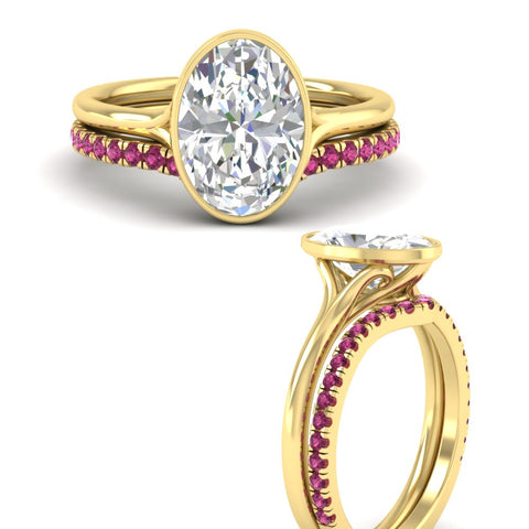 oval-shaped-diamond-bezel-solitaire-ring-with-pink-sapphire-band-in-yellow-gold-FD11229OVGSADRPIANGLE3-NL-YG.jpg?v=1758702860