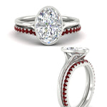 Load image into Gallery viewer, oval-shaped-diamond-bezel-solitaire-ring-with-ruby-band-in-white-gold-FD11229OVGRUDRANGLE3-NL-WG_10b35142-aeba-4e30-aa28-17b68de6cfa3.jpg?v=1758702938
