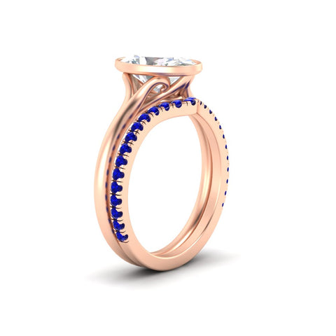 oval-shaped-diamond-bezel-solitaire-ring-with-sapphire-band-in-rose-gold-FD11229OVGSABLANGLE2-NL-RG_fb43f000-98e5-4819-b1c0-269c740b3c32.jpg?v=1758702938