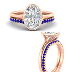 Load image into Gallery viewer, oval-shaped-diamond-bezel-solitaire-ring-with-sapphire-band-in-rose-gold-FD11229OVGSABLANGLE3-NL-RG_551e5449-b7e2-49c6-aa80-bb45f722b90a.jpg?v=1758702938
