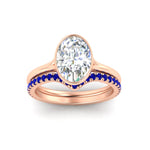 Load image into Gallery viewer, oval-shaped-diamond-bezel-solitaire-ring-with-sapphire-band-in-rose-gold-FD11229OVGSABLANGLE5-NL-RG_cd2637dd-f6ed-404a-a3f9-7498599f6b31.jpg?v=1758702938
