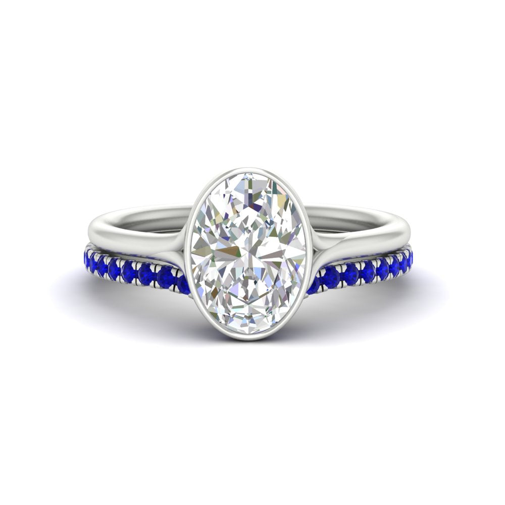 oval-shaped-diamond-bezel-solitaire-ring-with-sapphire-band-in-white-gold-FD11229OVGSABL-NL-WG_df2a17df-9f7c-411d-8148-4d80c5952fdc.jpg?v=1758702938