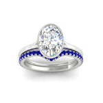 Load image into Gallery viewer, oval-shaped-diamond-bezel-solitaire-ring-with-sapphire-band-in-white-gold-FD11229OVGSABLANGLE5-NL-WG_47ca6d77-9b70-4f97-a841-954c45c6ece8.jpg?v=1758702938
