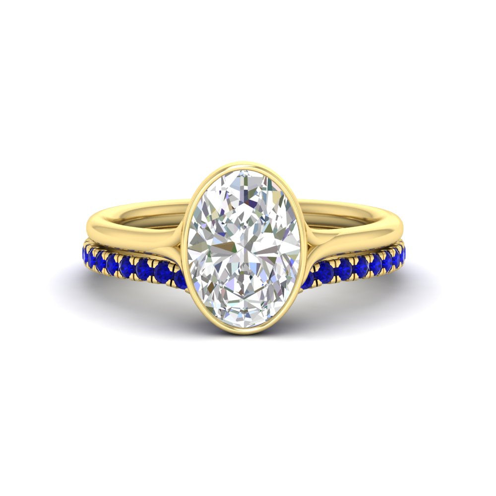 oval-shaped-diamond-bezel-solitaire-ring-with-sapphire-band-in-yellow-gold-FD11229OVGSABL-NL-YG_5c79c337-df04-4097-99d5-7858c5dd02ae.jpg?v=1758702938
