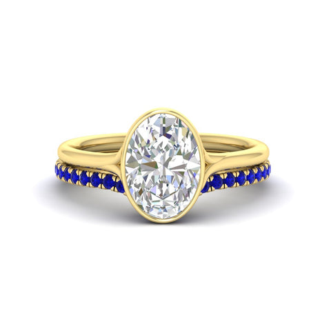 oval-shaped-diamond-bezel-solitaire-ring-with-sapphire-band-in-yellow-gold-FD11229OVGSABL-NL-YG_5c79c337-df04-4097-99d5-7858c5dd02ae.jpg?v=1758702938
