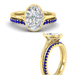 Load image into Gallery viewer, oval-shaped-diamond-bezel-solitaire-ring-with-sapphire-band-in-yellow-gold-FD11229OVGSABLANGLE3-NL-YG_e0e86c83-e7e4-4369-9500-1620c8232ff5.jpg?v=1758702938
