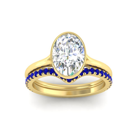 oval-shaped-diamond-bezel-solitaire-ring-with-sapphire-band-in-yellow-gold-FD11229OVGSABLANGLE5-NL-YG.jpg?v=1758702860