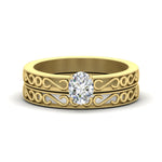Load image into Gallery viewer, oval-shaped-filigree-single-stone-diamond-wedding-ring-set-in-yellow-gold-FDENS3289OV-NL-YG.jpg?v=1763371069
