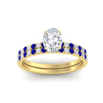 Load image into Gallery viewer, oval-shaped-french-pave-sapphire-wedding-ring-set-in-yellow-gold-FD11408OVGSABLANGLE5-NL-YG_55d0170b-ee03-448b-b332-e4e360941008?v=1763104442

